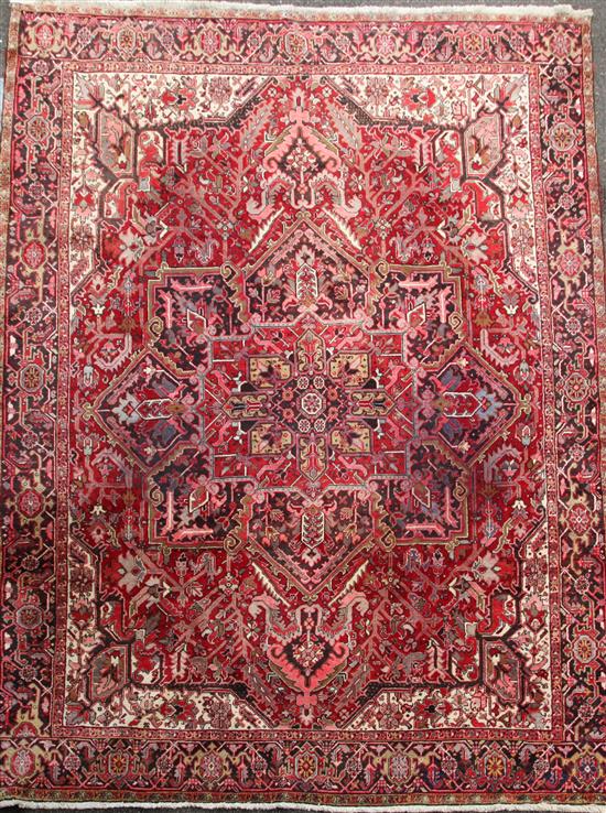 A red ground Heriz carpet, 12ft 8in by 10ft.